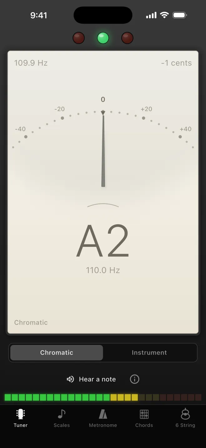 The Guitar Toolbelt tuner: a cream analogue meter face reading A2 at 109.9 Hz, one cent flat, set into a dark chassis with indicator lamps and an input level meter.